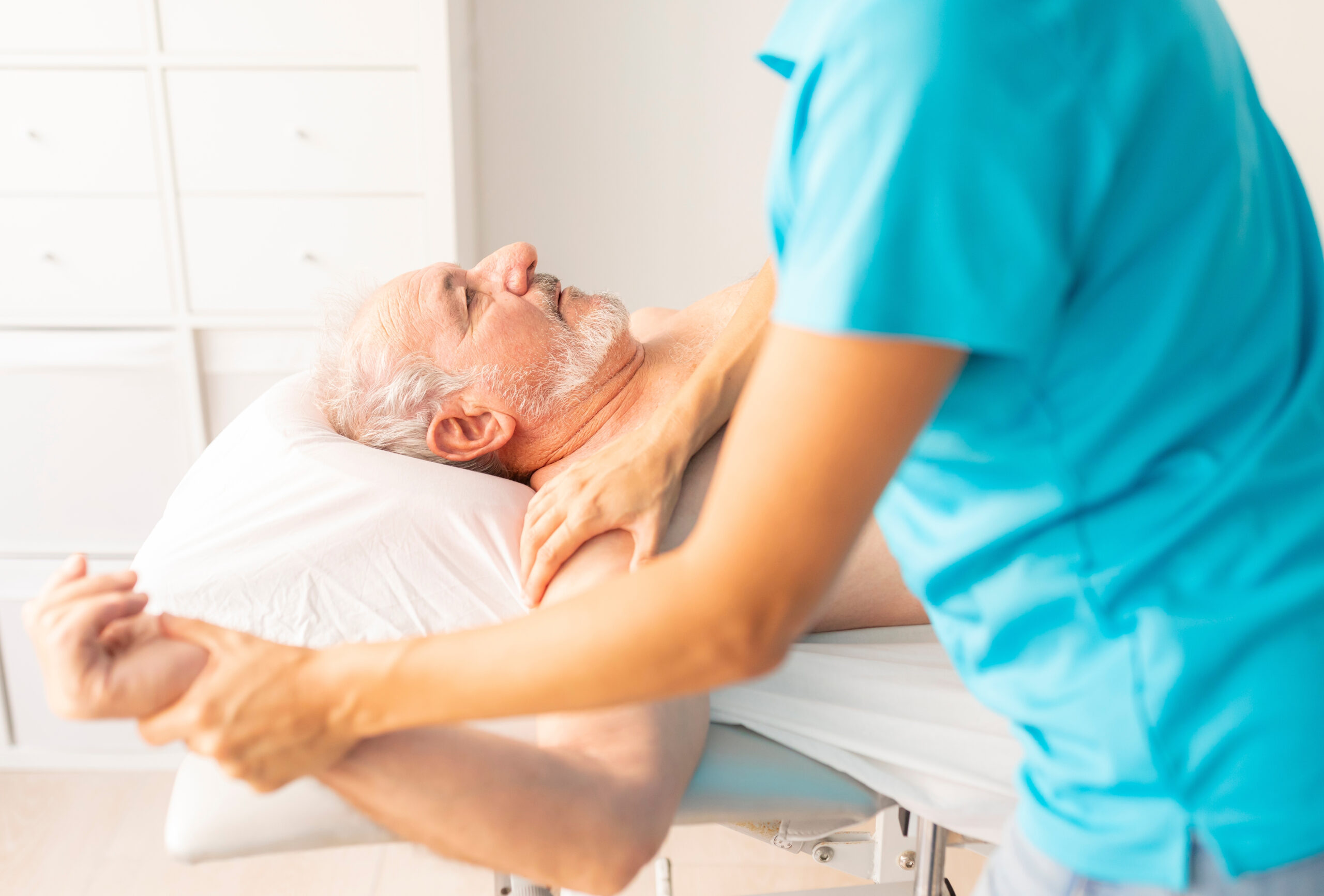 An,Older,Man,,Lying,On,The,Table,In,A,Physiotherapy